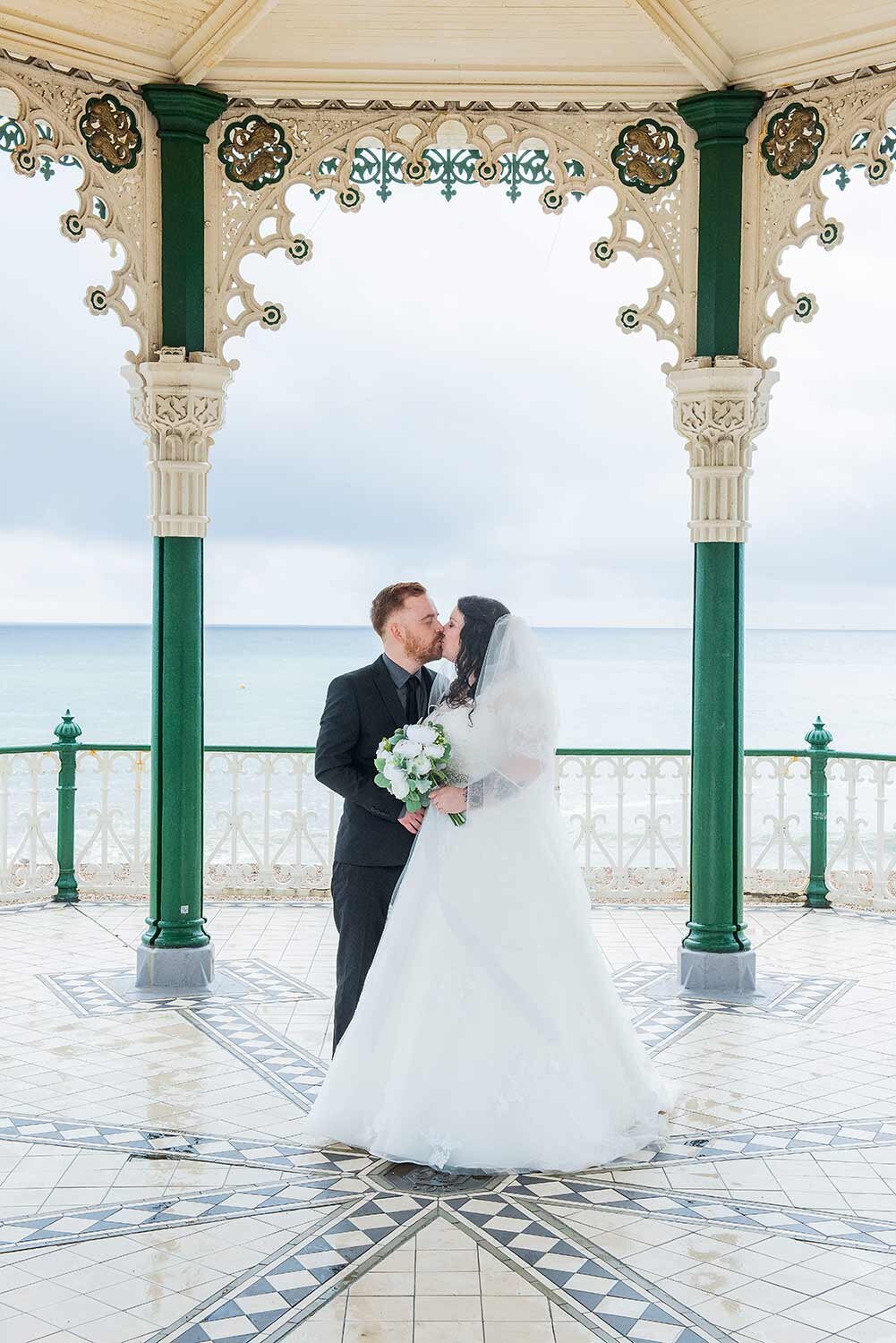 Bride and groom couple wedding portrait brighton band stand