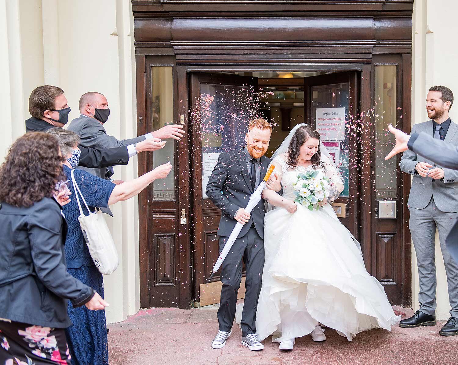 groom and bride confetti shot at brighton town hall