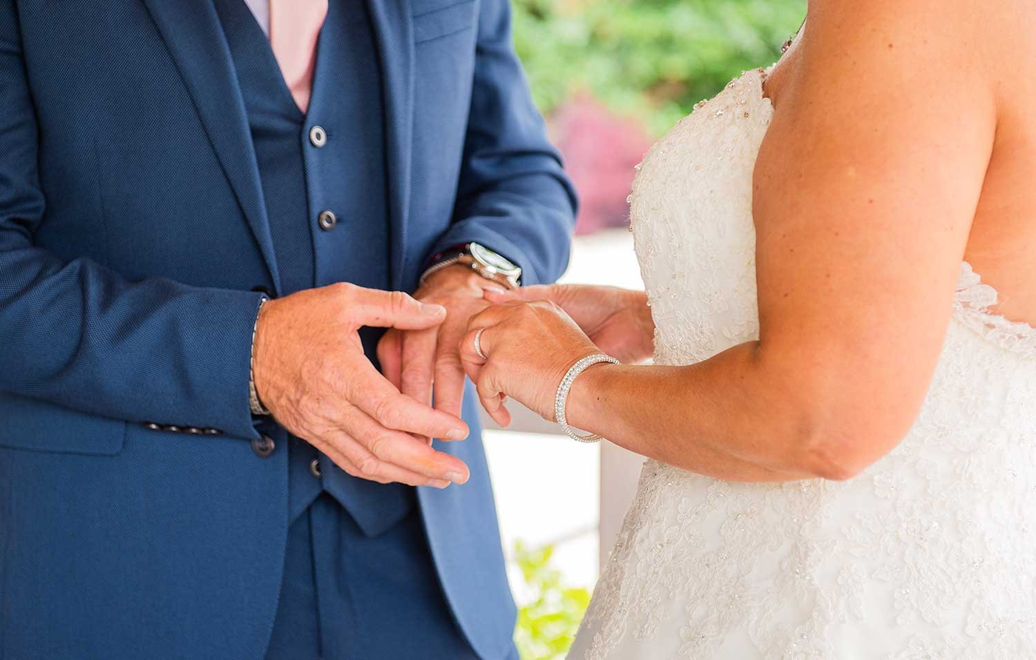 Exchanging wedding rings at Field Place Manor House