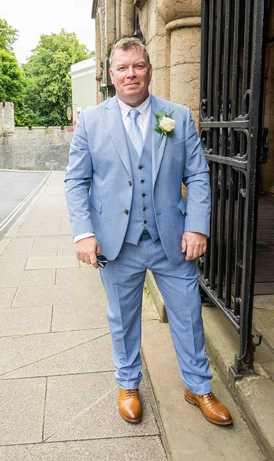 Close-up portrait groom smiling on his wedding day in Arundel
