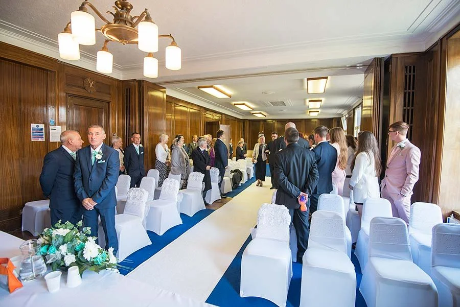 Light-filled ceremony room inside Worthing Town Hall set for an intimate wedding.