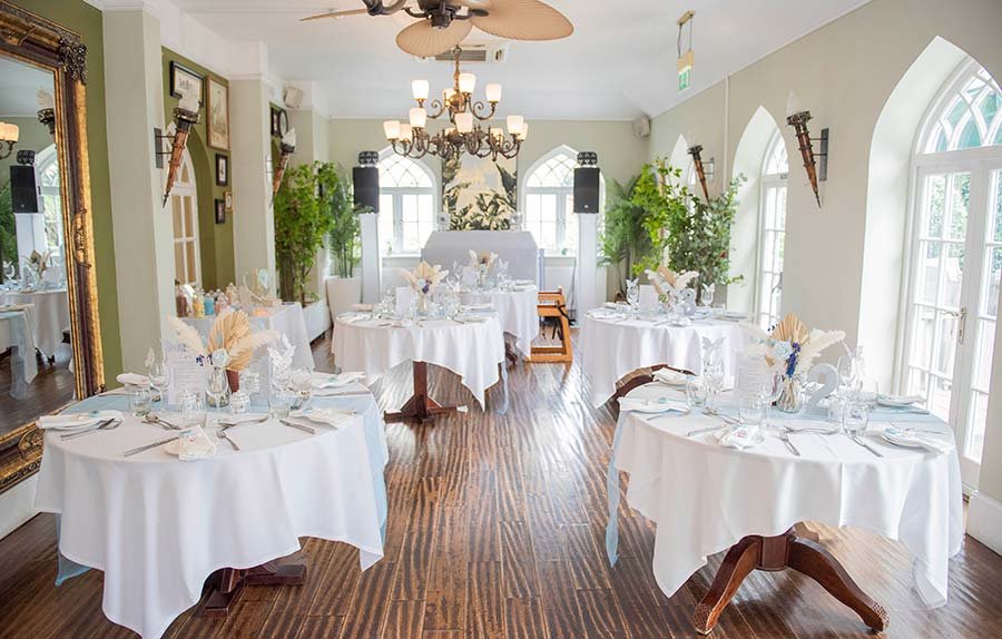 Wedding dining area at Angmering Manor Hotel set up for a reception