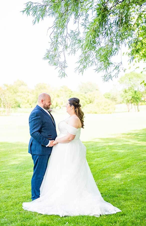 Sussex bride and groom posing at Ham Manor Golf Club in Angmering