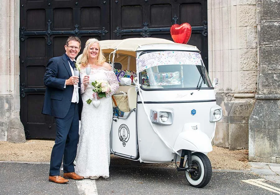 Bride and groom portrait near The Norfolk Arms in Arundel, West Sussex, with Arundel streets and historic buildings in the background.