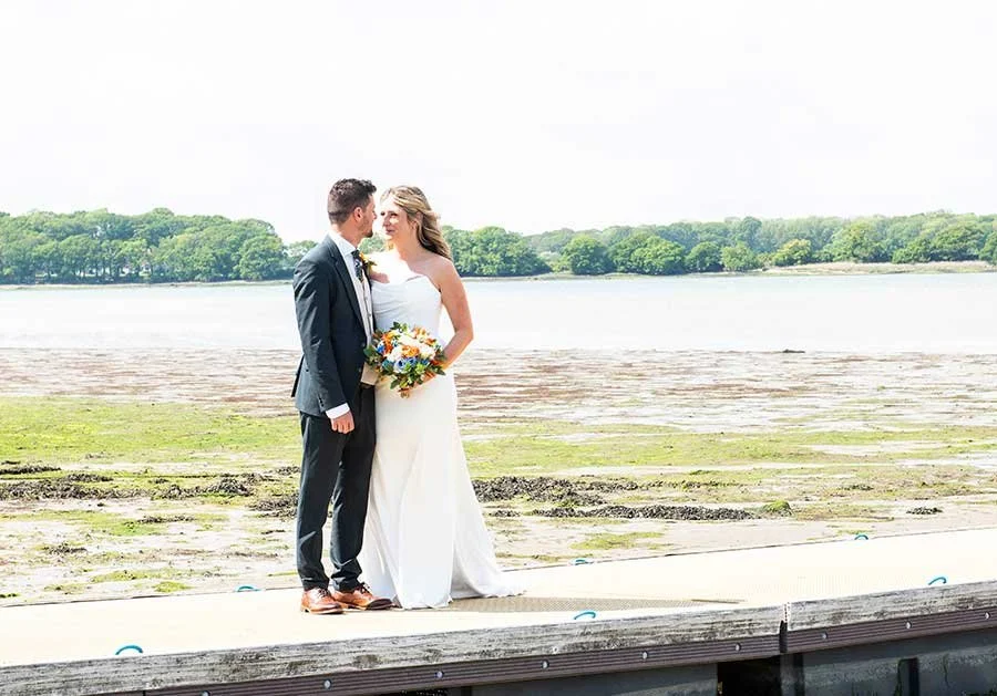 Bride and groom photographed at Chichester Harbour Park on their wedding day