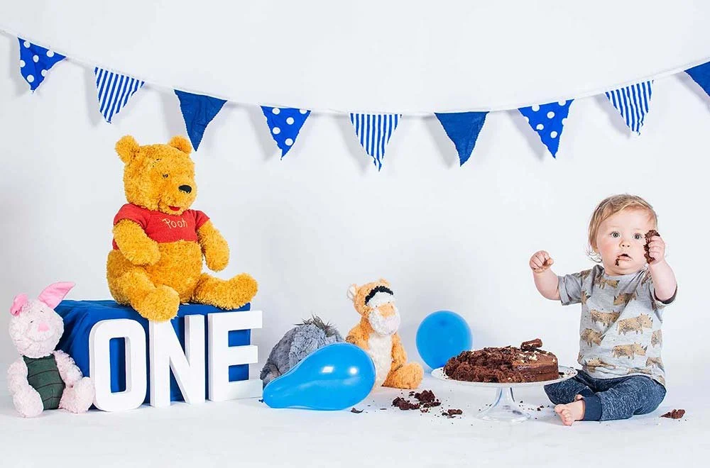 photo of baby having a cake smash photography session