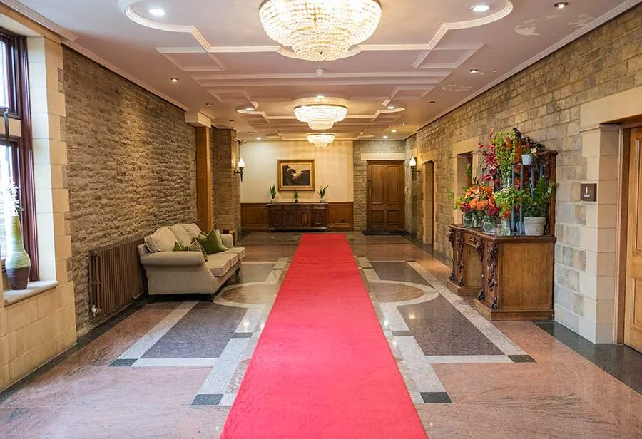 Inside view of South Lodge in Horsham, showcasing its entrance and surrounding grounds.