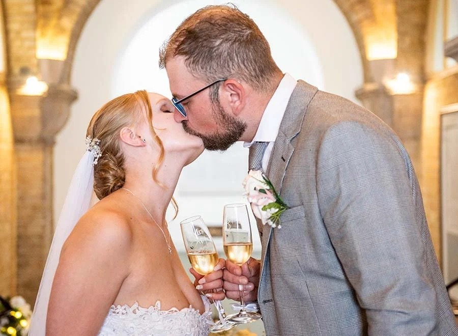 Bride and groom sharing a kiss at Arundel Town Hall