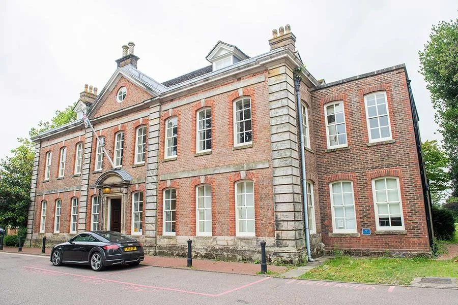 Exterior of Park House Registry Office in Horsham, West Sussex, showing the elegant building and landscaped surroundings.