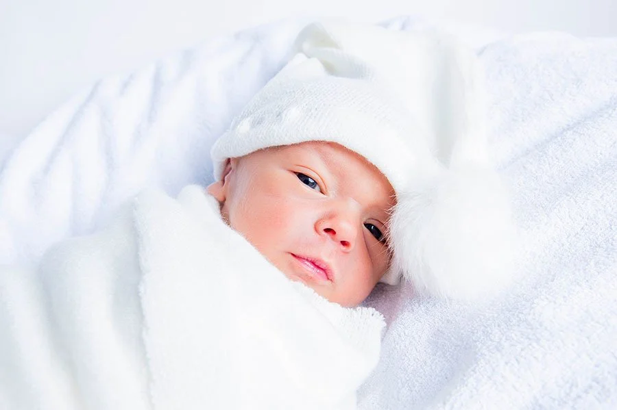 Close-up newborn photography in our Littlehampton studio, capturing a peaceful posed moment