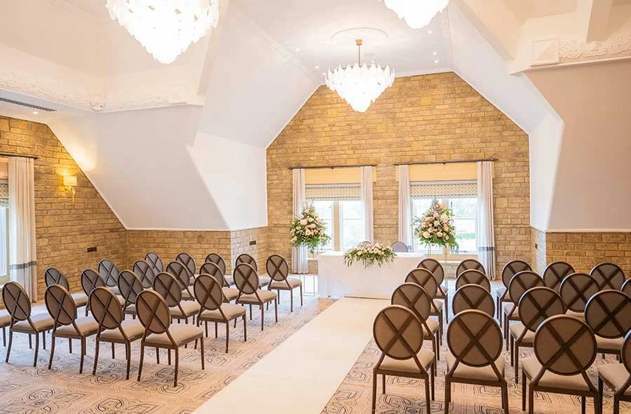 South Lodge wedding ceremony venue decorated for the couple’s special day, ready for guests to take their seats.