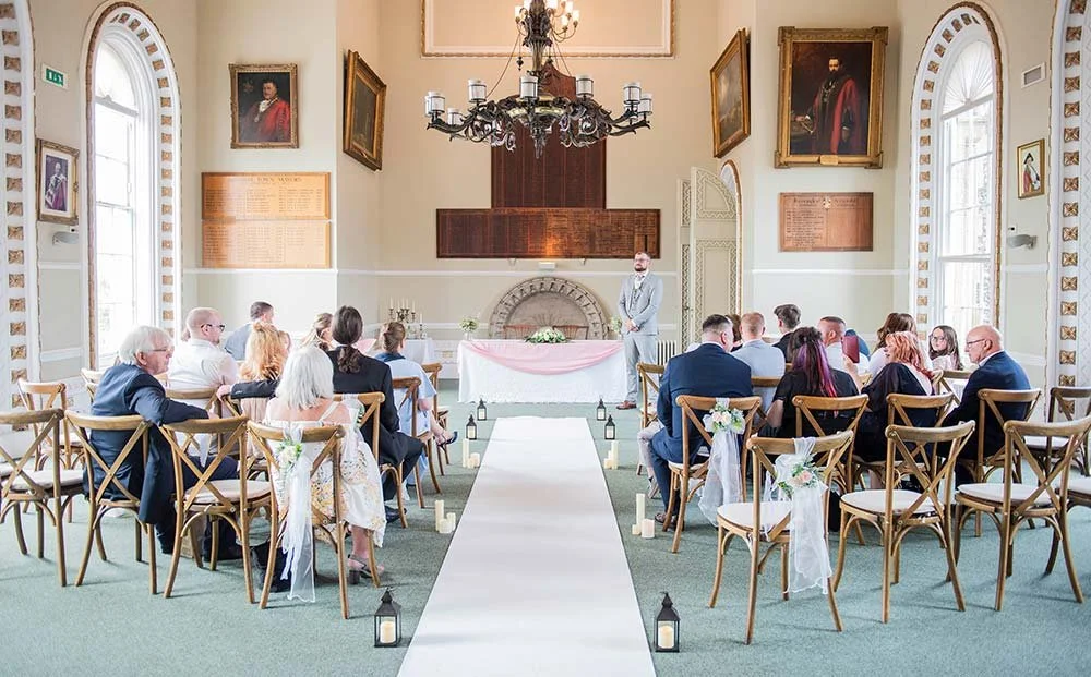 Groom standing at Arundel Town Hall ceremony waiting for the bride