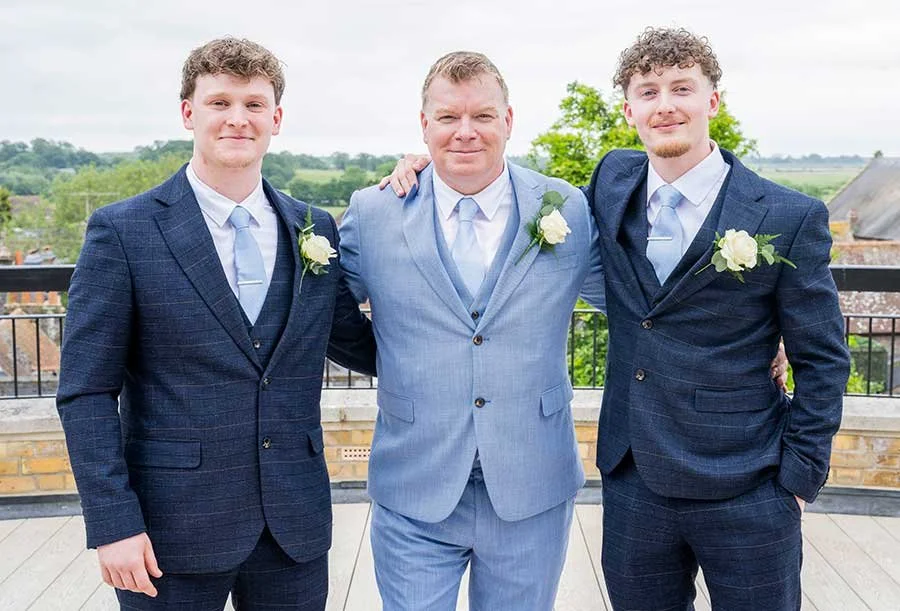Group wedding photo groom, and boys outside Arundel Town Hall