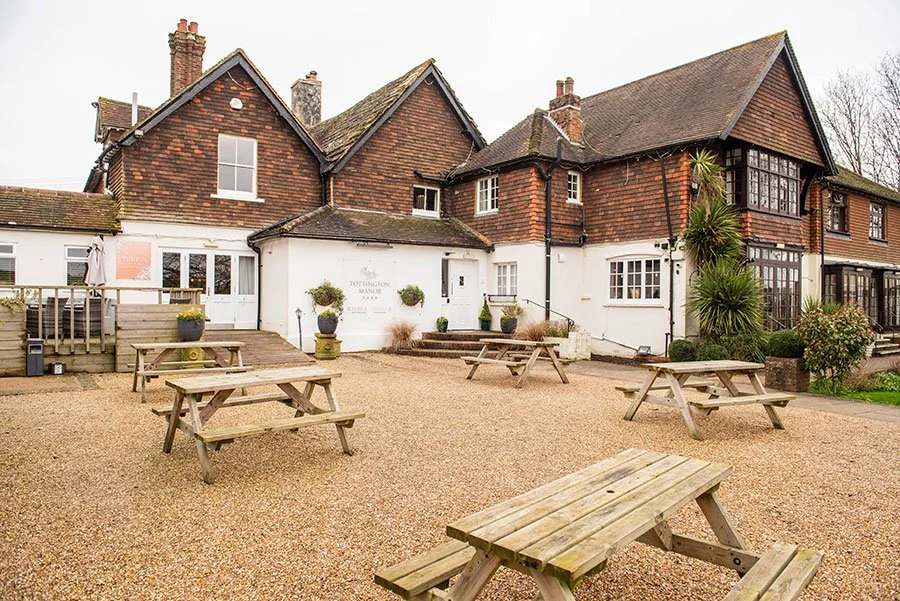 Countryside wedding venue exterior at Tottington Manor with historic manor house architecture.