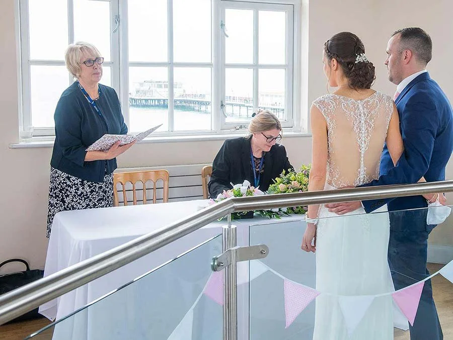 Bride and groom during ceremony at Worthing Dome, Worthing, Sussex.