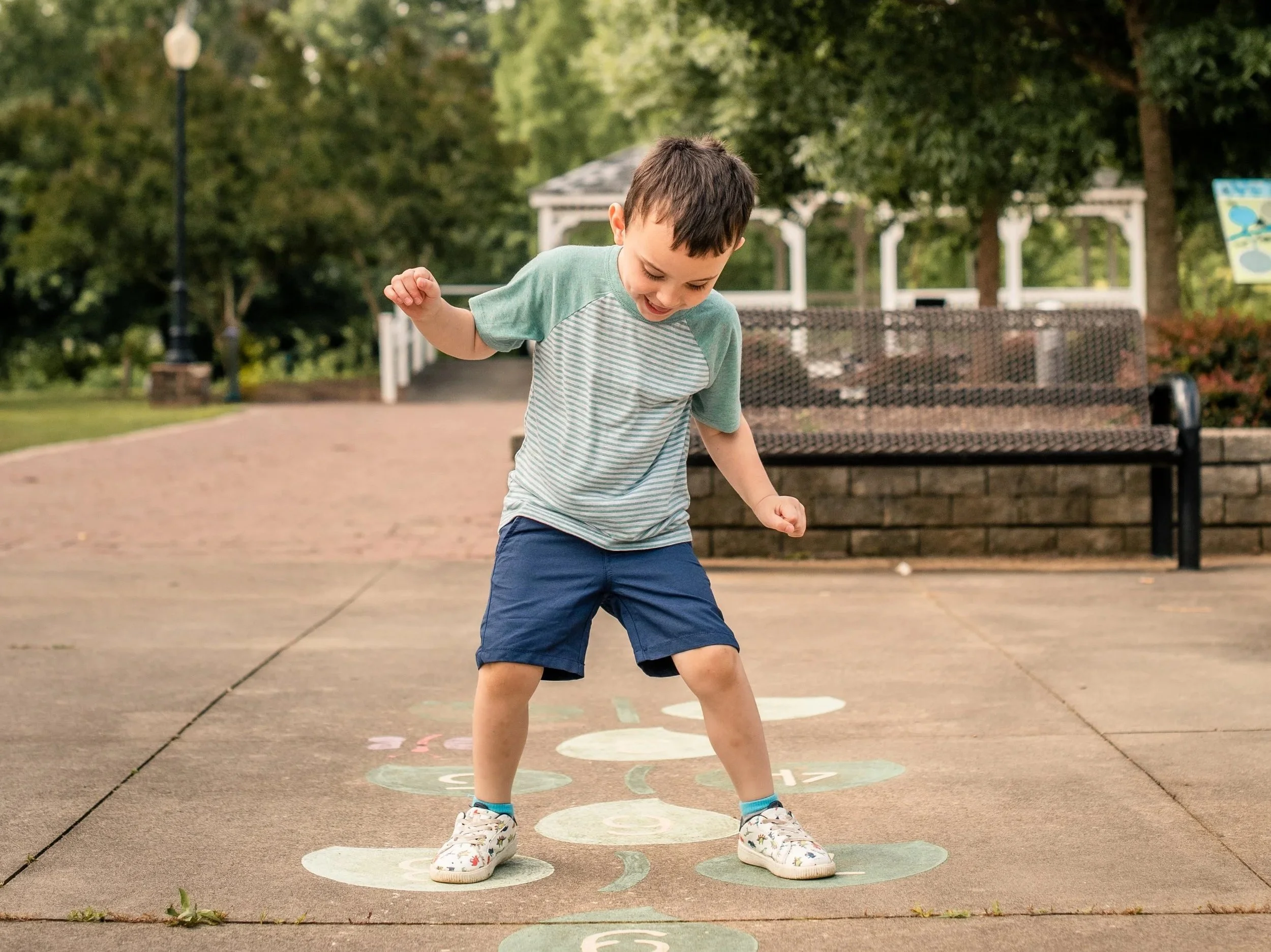 hild portrait photography Burlington City Park Gibsonville NC — young boy playing outdoors, milestone session