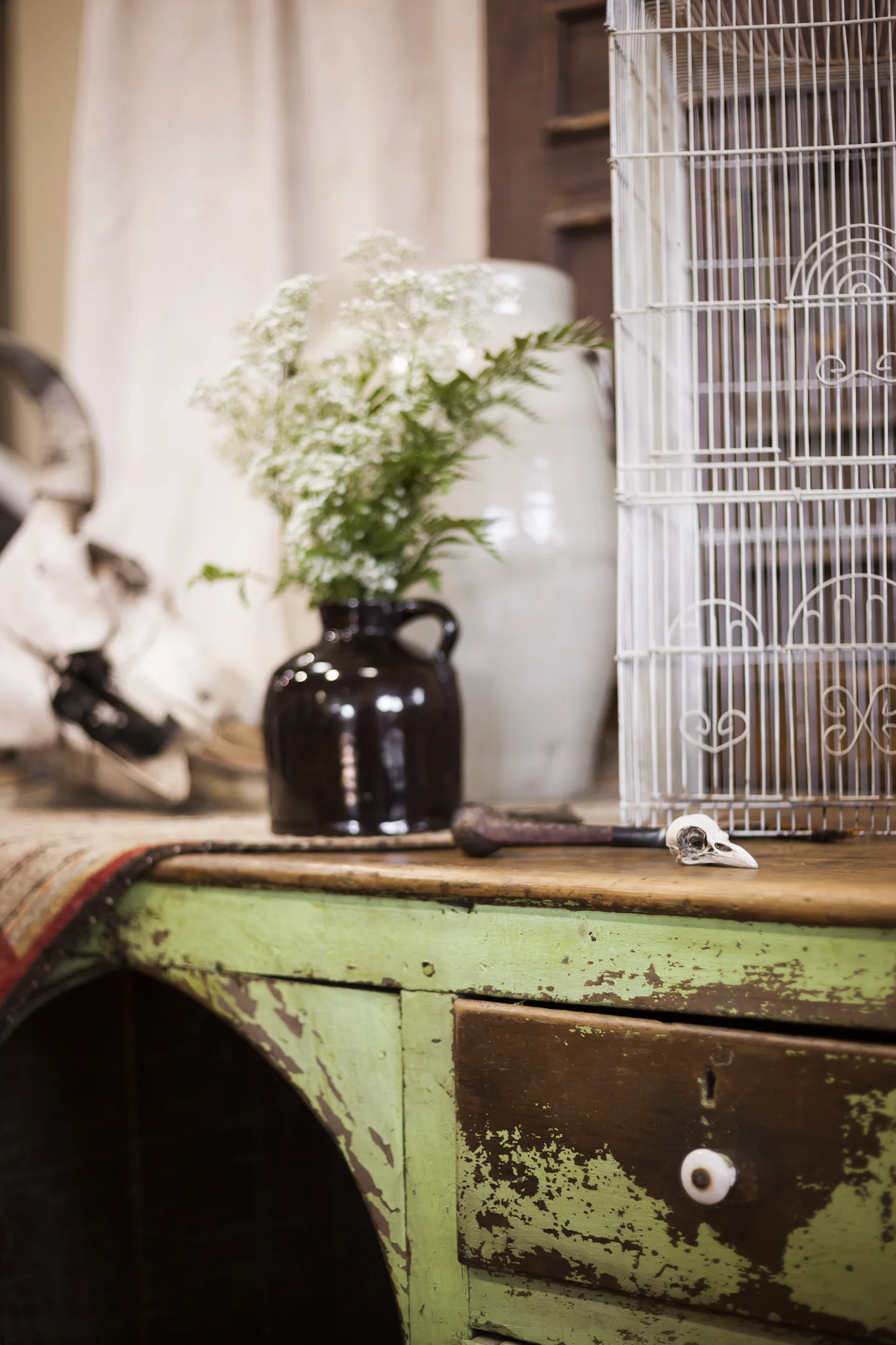 Aged Skull and Vintage Vase on a Distressed Old Desk
