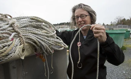 Jan Straley of the Sitka Sound Science Center with whale deterrent gear.
