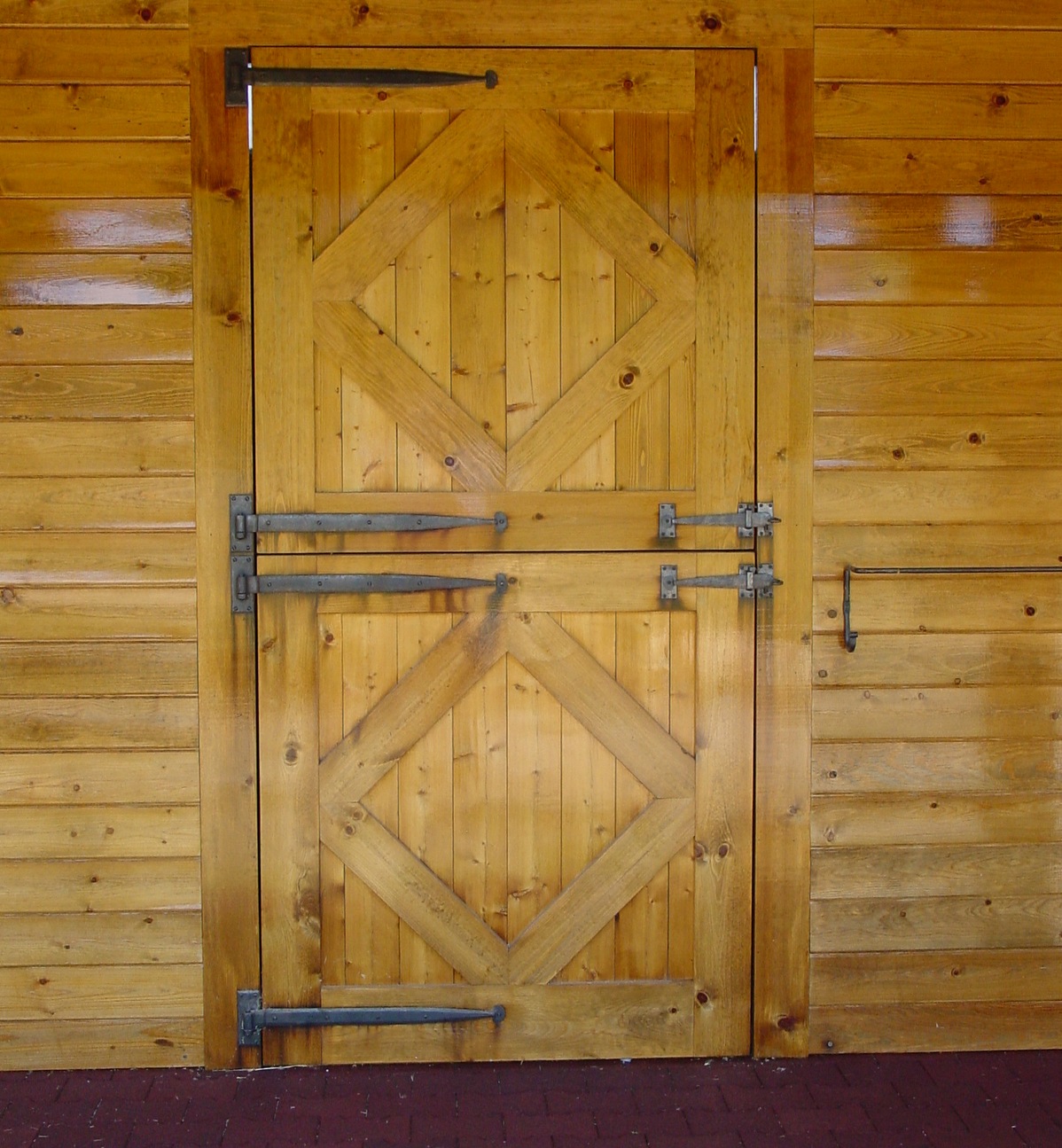 Both the barn and&nbsp;stall dutch doors are custom built pine with custom designed, hand-forged iron, period strap hinges and&nbsp;one of a kind latches and blanket rails. The interlocking rubber aisle&nbsp;way pavers are 1-3/4" thick.