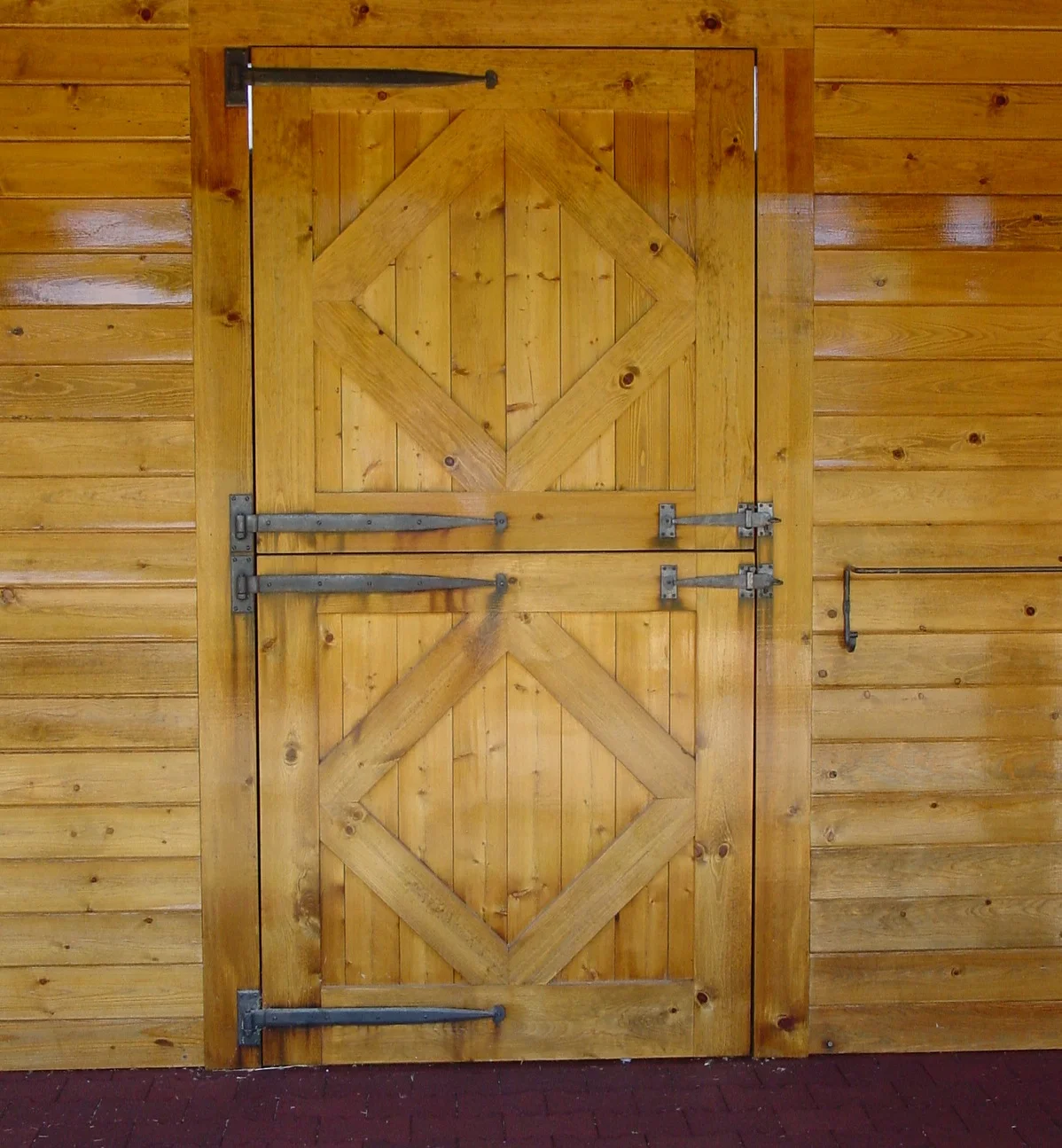 Both the barn and stall dutch doors are custom built pine with custom designed, h and-forged iron , period strap hinges and one of a kind latches and blanket rails. The interlocking rubber aisle way pavers are 1-3/4" thick.