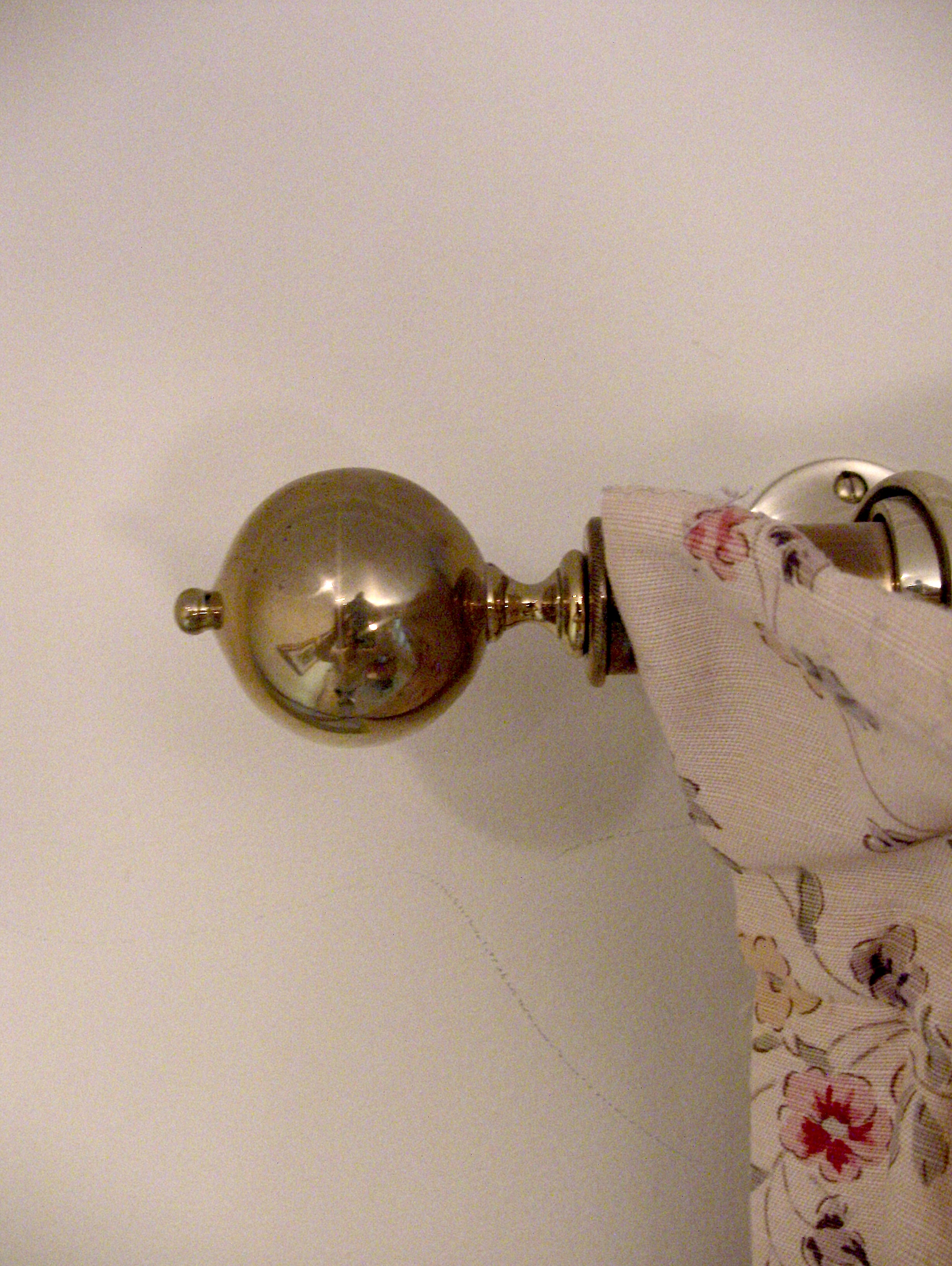 Brass curtain rods in the Morning Room and throughout the house are tipped with reproduction brass finials. Each is a clone of an original antique and were made in Buxhill, England by Brass Foundry Castings Ltd.