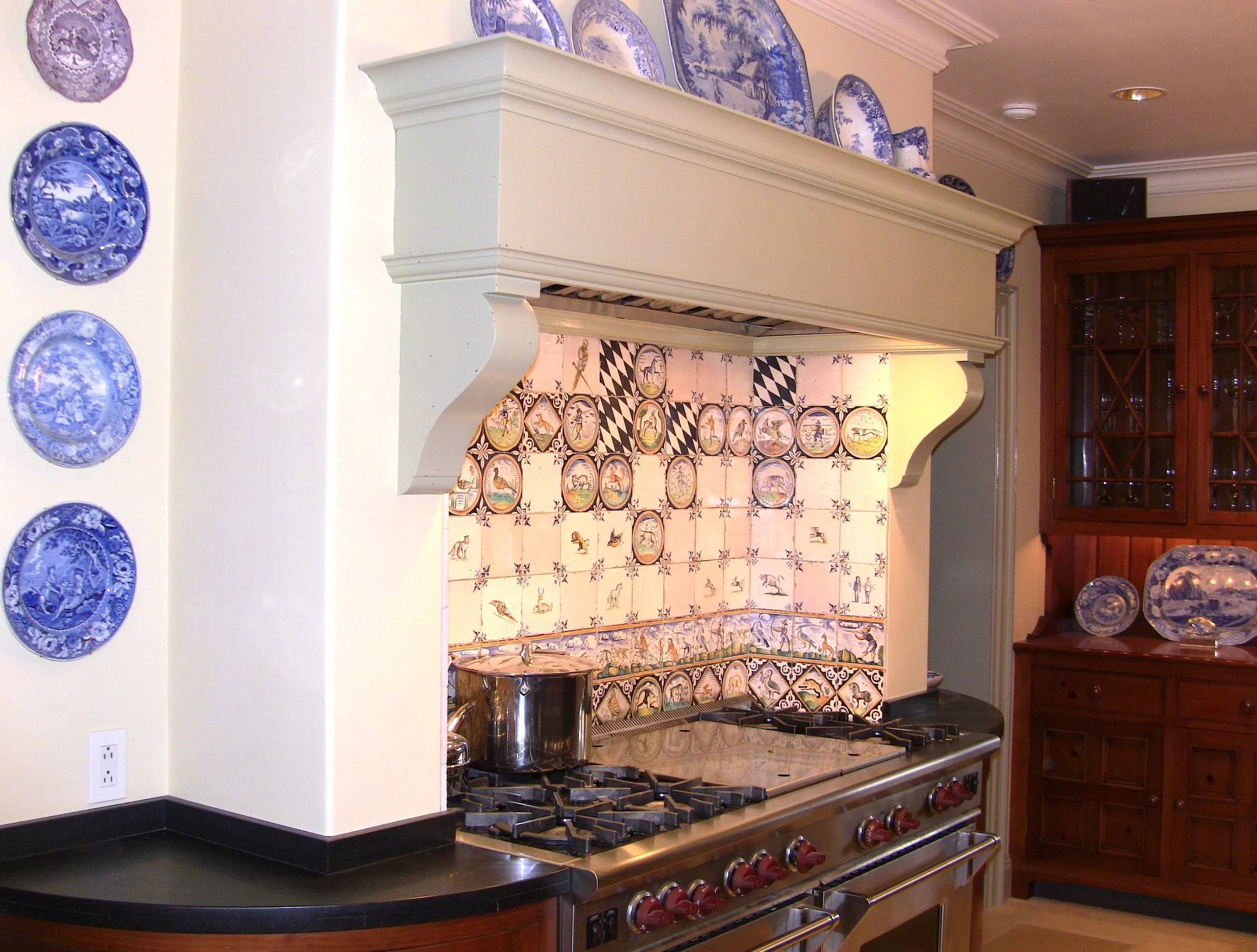 60" Wolf Range with grill and griddle surrounded by delft tiles.