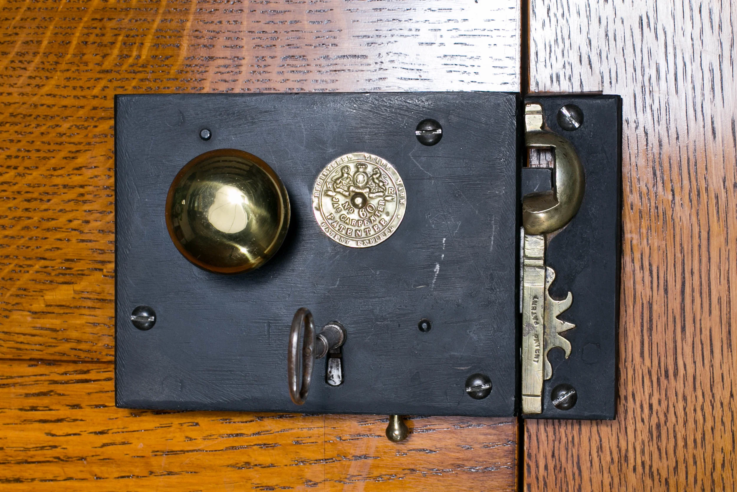 This antique Carpenter lock bears the coat of arms for King William IV who reigned Great Britain and Ireland between 1830 and 1837. This design was originally patented by James Carpenter and&nbsp;began production in England &nbsp;in 1830