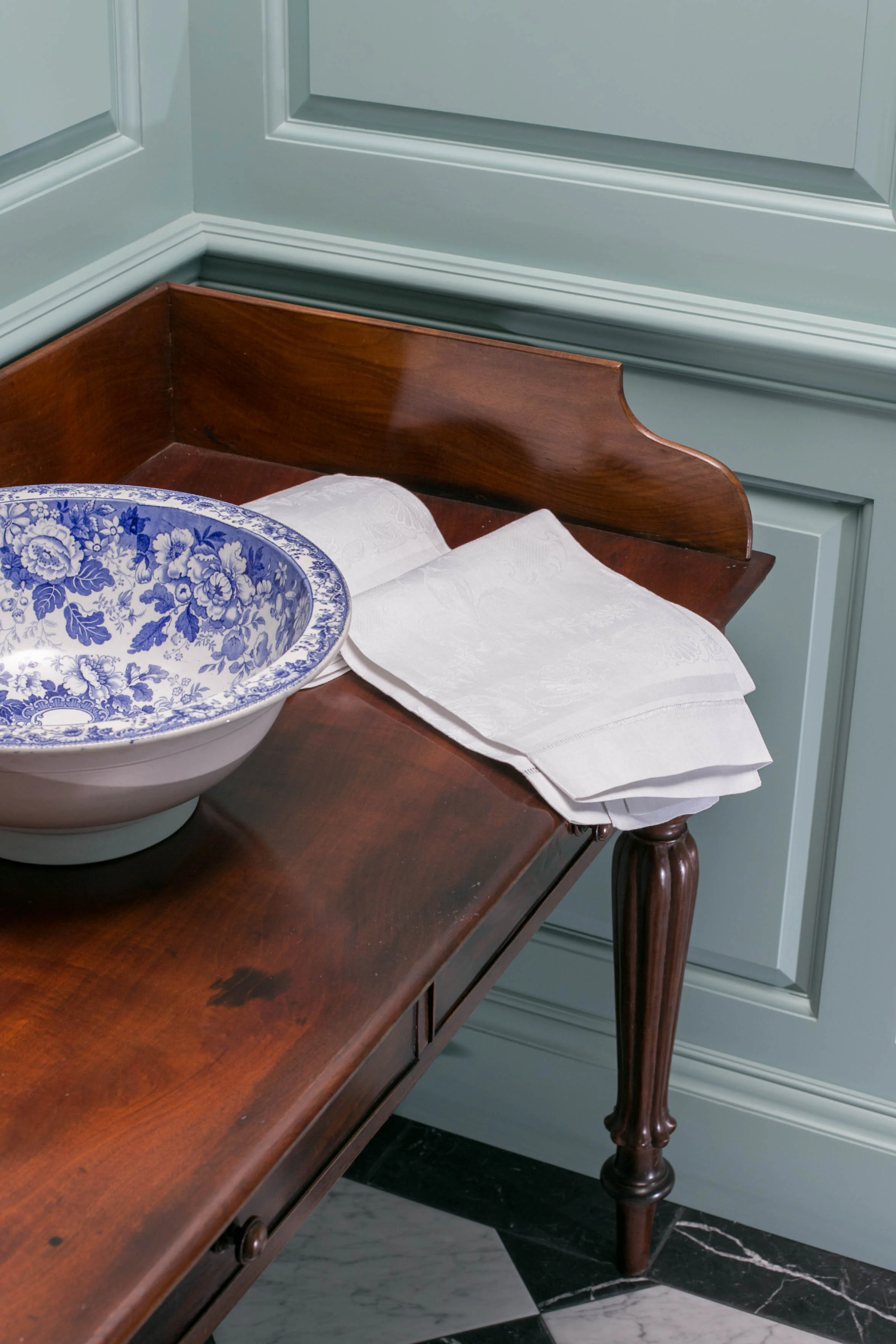 Antique mahogany washstand with an Antique blue and white basin