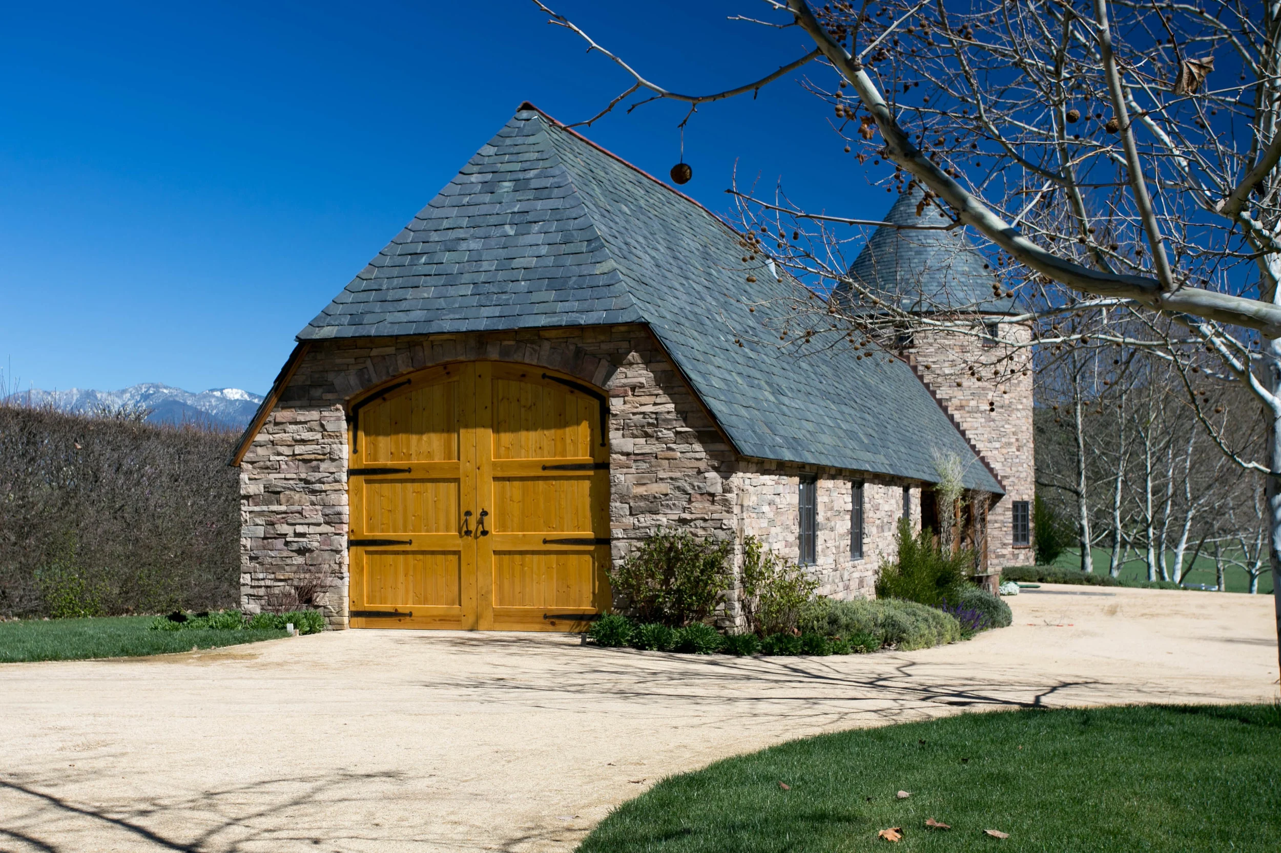The stable and tower both have&nbsp;graduated slate and copper roofing with an imported English clay tile "hogsback"&nbsp;ridge&nbsp;cap.