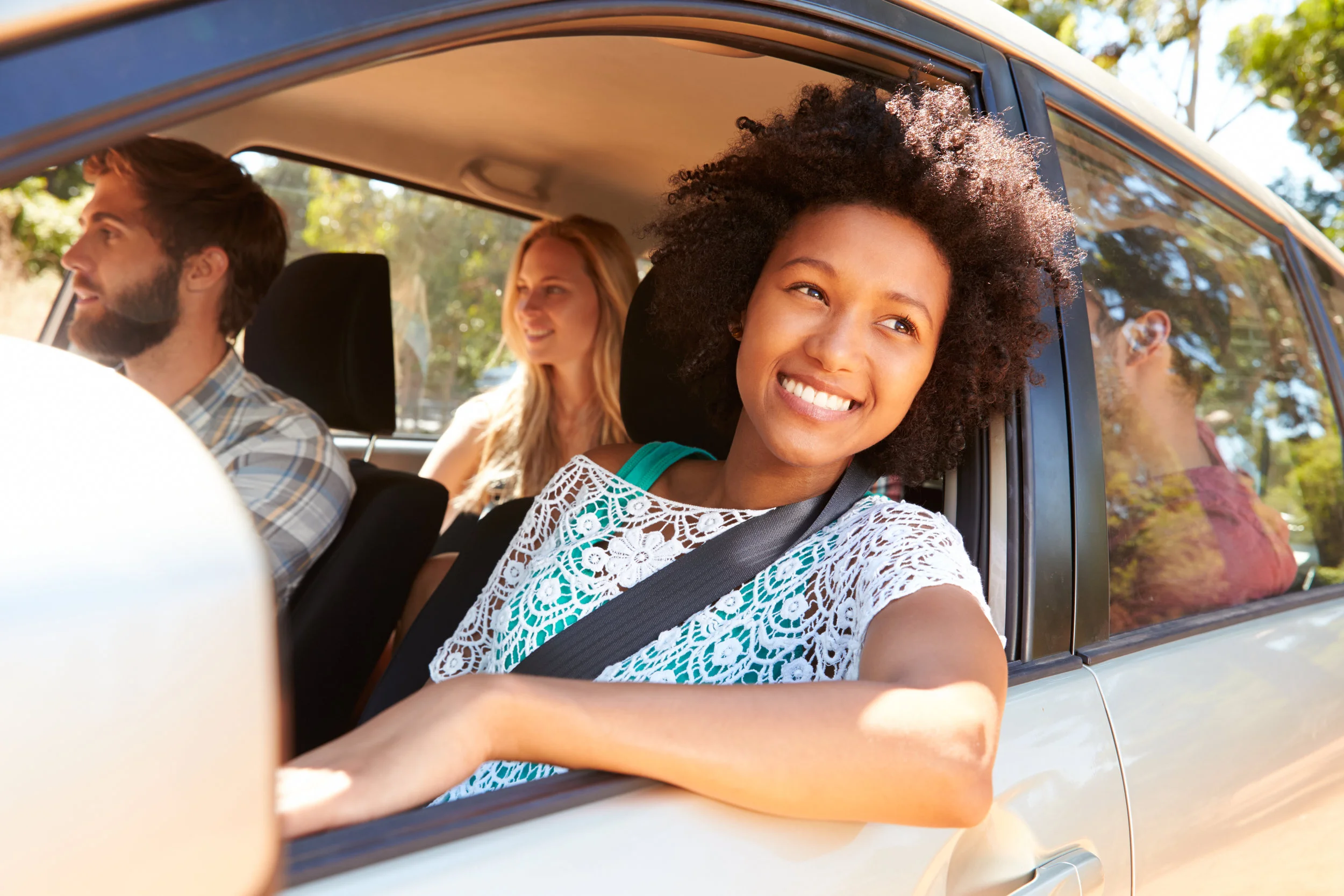 A-group-of-friends-driving-in-a-car-together-473420470_5184x3456.jpeg