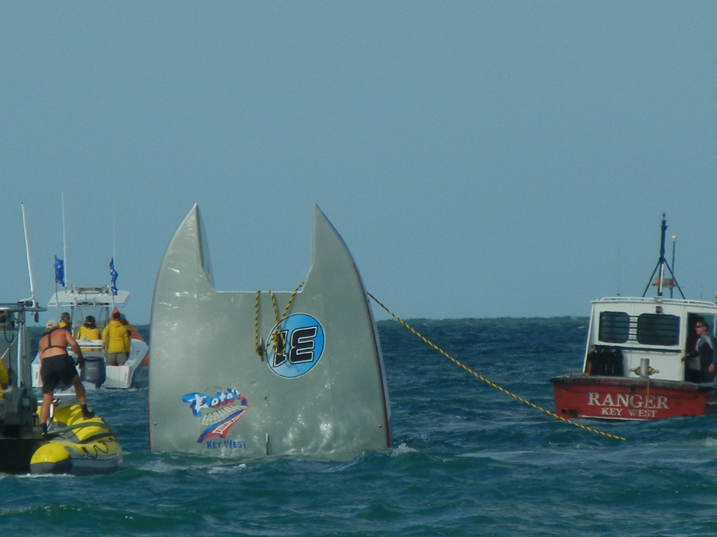 Salvage workers attempt to recover the Page Motorsports catamaran that flipped in the November 2011 SBI World Championships in Key West Harbor. Throttleman Joey Gratton was killed in the wreck. 