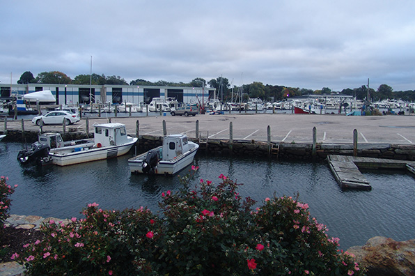 An Aug. 13 tidal surge flooded this Wickford parking lot, across the way from Gardner’s Wharf Seafood. (Frank Carini / ecoRI News)