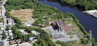 The former Tidewater Street gasification plant in Pawtucket is boarded by residential properties, three schools and the Seekonk River. (National Grid)