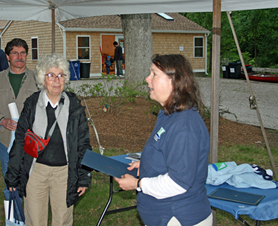 Madeline Jeffery, left, and Denise Poyer at last year’s Wood-Pawcatuck Watershed Association annual meeting. (David Smith)