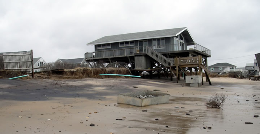 Erosion around beachfront properties can expose components of septic systems that were once buried. (R.I. Sea Grant)