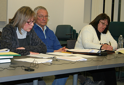 Catherine Sparks, left, DEM’s assistant director for natural resources for DEM, led the hearing March 30 on proposed changes to state fishing regulations. Joining her were Alan Libby, principal freshwater biologist at DEM, and DEM deputy chief Christine Dudley. (David Smith/ecoRI News)