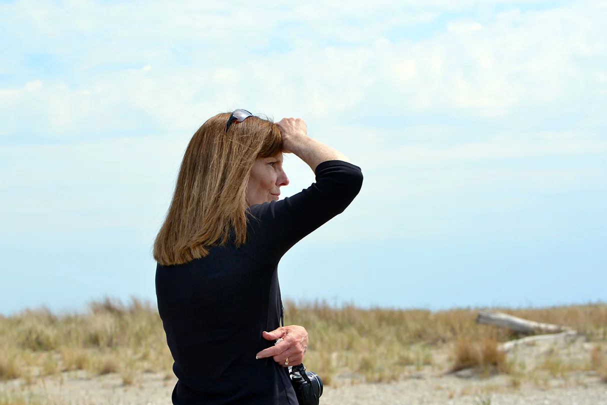 Janice Sassi, manager of Napatree Point conservation area is on the lookout for piping plovers. Sassi, an avid photographer and birder, loves her job. She was devastated when she returned to Napatree Point after Superstorm Sandy in 2012 to see dunes flattened and breached.