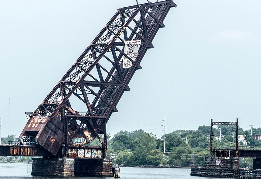 Activists attached a 'Fracked Gas: A Bridge to Nowhere' banner to the Crook Point Bascule Bridge in Providence to protest the expansion of a natural-gas pipeline and compressor station in Rhode Island. The June 12 protest was one of several across southern New England this week to counter plans to build and expand pipelines across the region. (FANG)