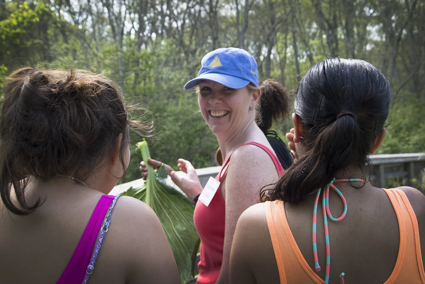 Stephanie Racine introduces her students to skunk cabbage, a plant that smells like its namesake.