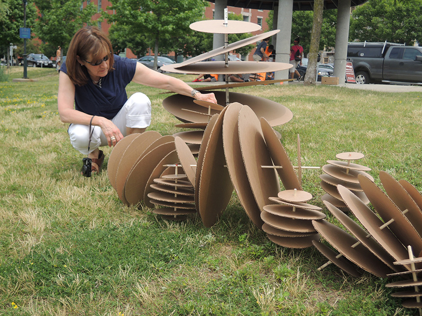 Scheri Fultineer, one of the projects leaders, experiments with a cardboard version of an oyster reef prototype. The real prototypes will be made of more durable materials, mainly metal and concrete. (RISD)