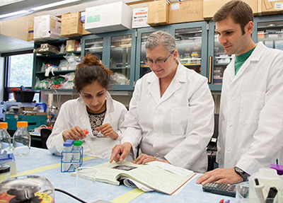 Rhode Island College associate professor of biology Rebeka Merson, middle, and students Keya Thakkar, left, and Timothy Bock Jr. are studying the impacts of PCBs on marine environments. (RIC)