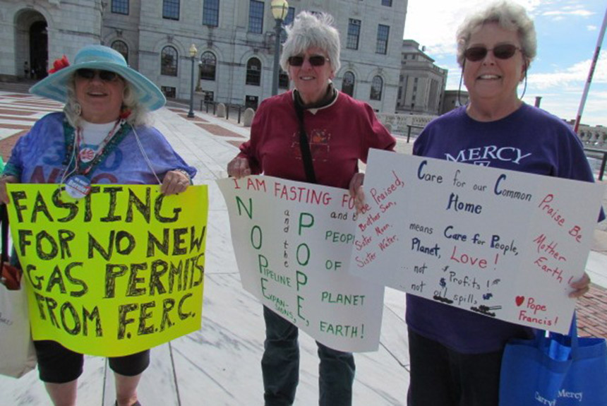 Jan Very-Creamer, left, Patricia Fontes, middle, Sister Mary Pendergast and other activists began fasting Sept. 22 in front of the Statehouse to protest the expansion of fossil fuels. (Tim Faulkner/ecoRI News)