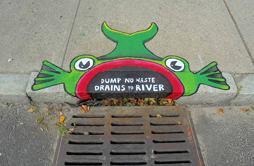 The Woonasquatucket River Watershed Council is working with artist and educator Brent Bachelder and The Met School to create storm-drain murals, such as this one in front of Donigian Park on Valley Street, along the Fred Lippitt Woonasquatucket River Greenway in Providence. (Brent Bachelder)