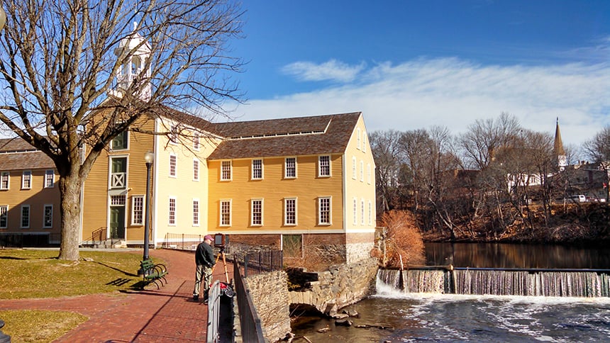 Water pours over a dam on the Blackstone River in Pawtucket, R.I., that helped power Slater Mill in the 18th and 19th centuries. (Kevin Proft/ecoRI News)