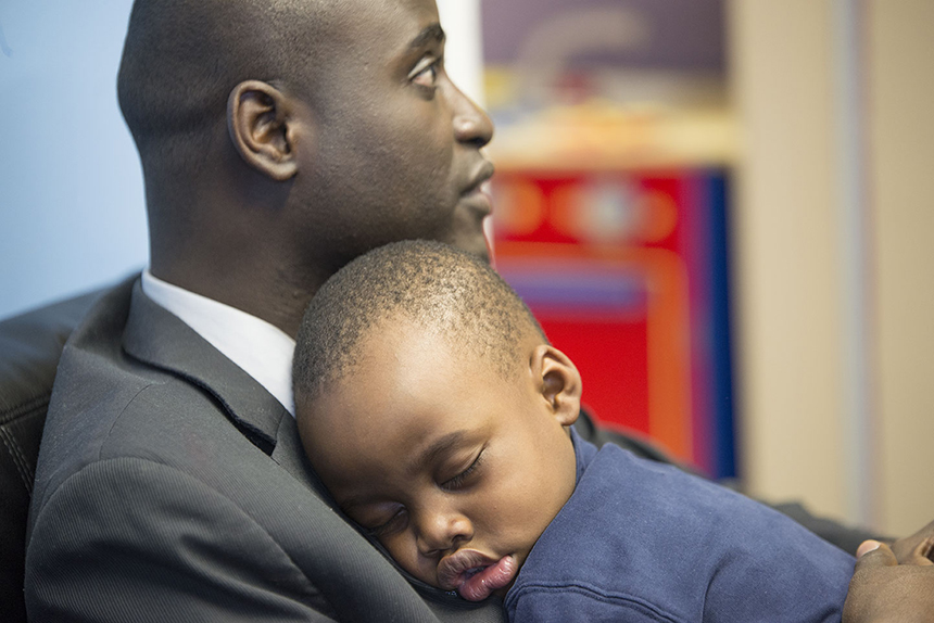 Omar Bah, with son Samba, was so overwhelmed by the kindness he enjoyed upon this arrival in Rhode Island that he’s committed to helping other refugees build a home here. (Joanna Detz/ecoRI News photos)