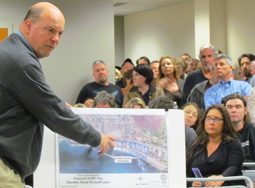 CRMC executive director Grover Fugate explains a new seawall proposal to council members. (Tim Faulkner/ecoRI News)