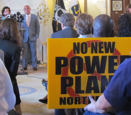 Anti-power-plant activists have followed Gov. Gina Raimondo to 30 public events, such as the announcement that General Electric is opening an office in Rhode Island.