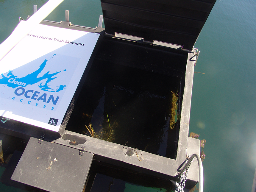 Two floating ‘trash cans’ were installed in Newport Harbor early last month to help clean the water and educate residents and tourists about the importance of their land-based behavior. The electric-powered skimmers suck up marine debris washed into the harbor by stormwater runoff and the wind; people don't actually throw trash directly into them. (Frank Carini/ecoRI News)