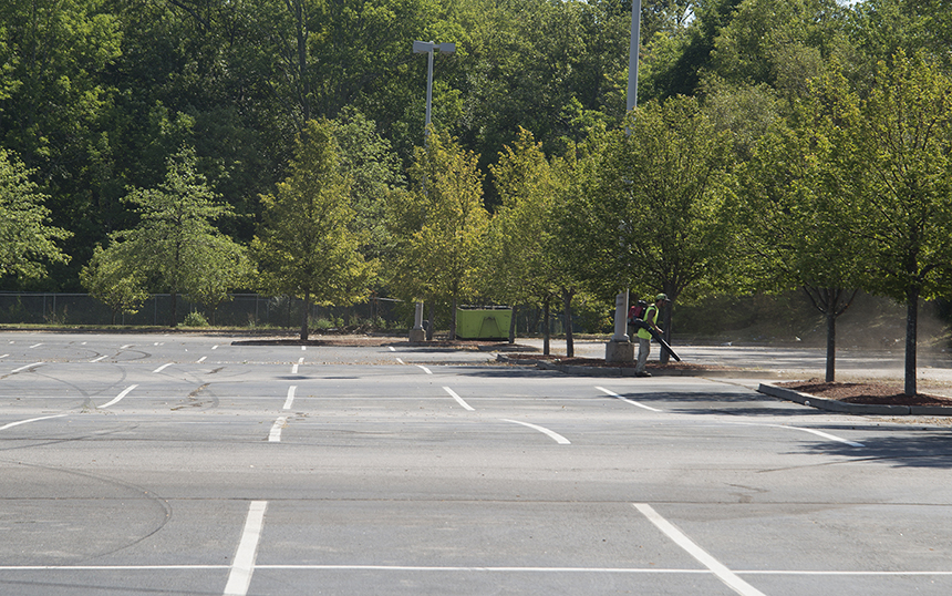 The vast parking lot of another vacant Lowe’s, this one in Woonsocket, is kept clean with a leaf blower. (Joanna Detz/ecoRI News)