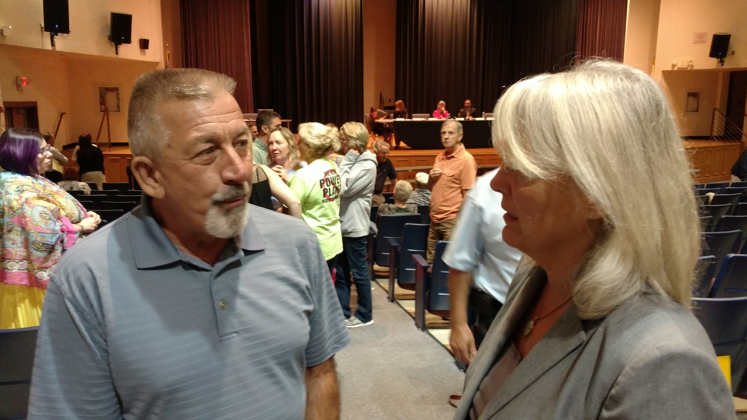 Burrillville resident Paul Bolduc speaks with Janet Coit of the Rhode Island Energy Facility Siting Board during a Sept. 21 public hearing. (Tim Faulkner/ecoRI News)
